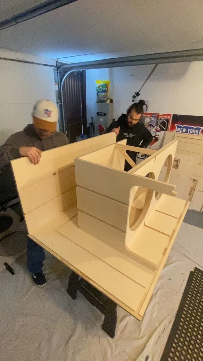 Crew fitting the walls of a sub cabinet