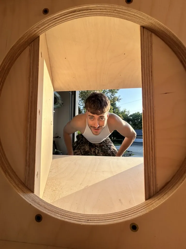 Looking through a driver cutout at a crew member