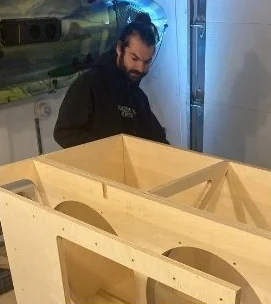 Jake Manolt working on a cabinet build
