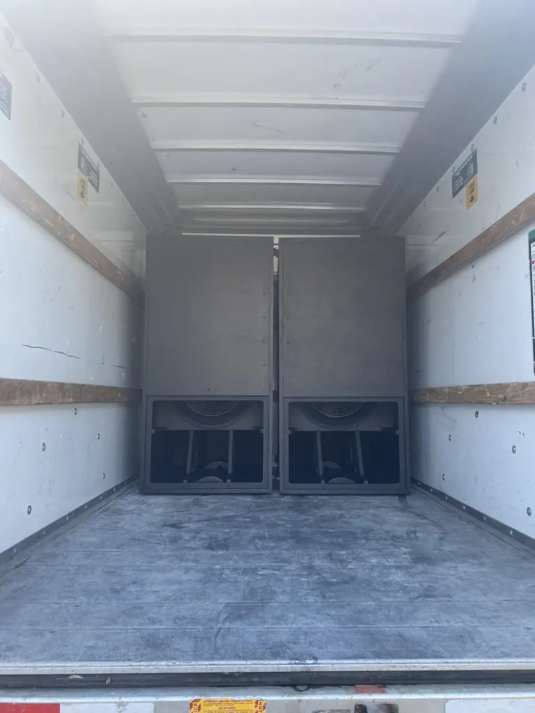 Subwoofers loaded in a box truck